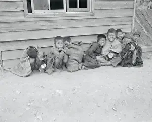 Young Distraught Koreans Resting Together in War Torn City