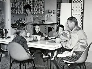 Breakfast Prints: Young Family Eating Breakfast in Kitchen