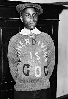 Young Father Divine Wearing Sweater with His Message