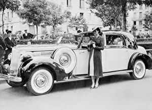 Young Female Model Standing by Car
