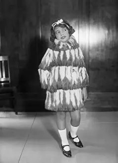 Pre Teen Girl Prints: Young girl (10-12 years) posing in fur coat
