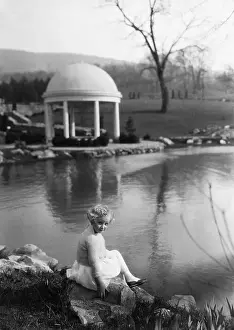 Pre Teen Girl Prints: Young girl (6-7 years) relaxing on rock in park