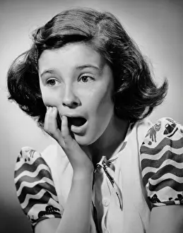 Young girl looking shocked