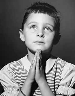 Young girl saying prayer