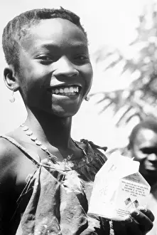 Young Guinea Child Holding Milk