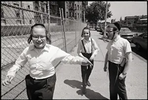 Three Young Hasidic Jews On Sidewalk