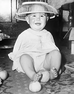 Thalidomide Prints: Young Infant Child Wearing Basket on his Head