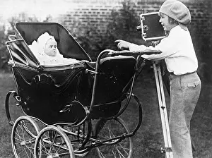 Young Jackie Coogan Taking Picture of His Infant Brother