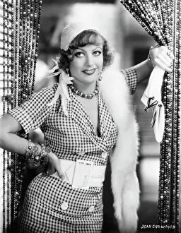 Prints of (Original Caption). Joseph M. Schenck presents Joan Crawford in Rain. United Artists Picture. 1932 A Glamorous Life Captured: A Young Joan Crawford