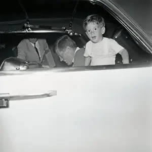 Young John F. Kennedy Gazing out of His Father's Limousine Window