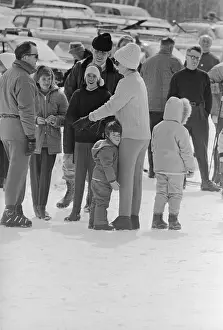 Stowe Prints: Young John F. Kennedy Jr. Holding Legs of His Mother on Ski Slope