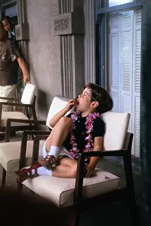 Young John F. Kennedy Jr. Sitting on Balcony