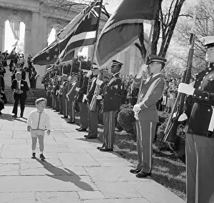 Young John F. Kennedy Jr. Standing Near Soldier Formation at Arlington