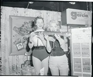 Young Ladies Holding Eel Lure for Bigger fish