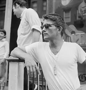 Young Man Leaning on Railing at Gaslight Coffee Shop