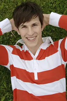 Cheer Prints: Young man lying on a meadow