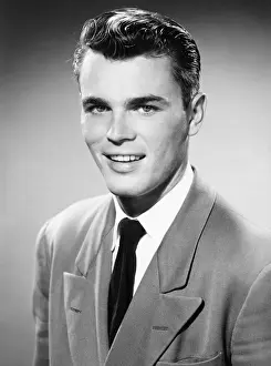 Sleek Hair Prints: Young man posing in studio, (B&W), (Close-up), (Portrait)