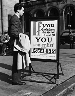 Decisions Prints: Young man reading US Marines recruitment post
