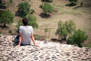 Images Dated 7th July 2011: Young man relaxing on a pyramid in Teotihuacan