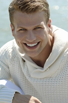Satisfaction Gallery: Young man by the sea, portrait