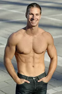 Young man smiling, portrait, bare-chested