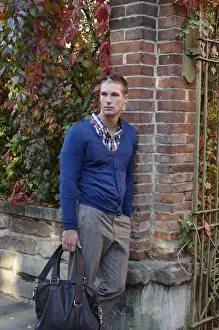 20 30 Prints: Young man waiting at a gate with a bag