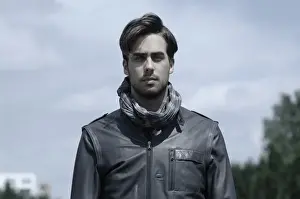 Introspection Prints: Young man wearing a leather jacket, portrait