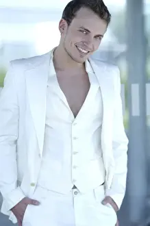 Suit Prints: Young man wearing a white suit, smiling