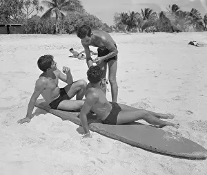 Young Men with Surfboard