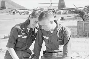 Young Military Couple Sitting Together