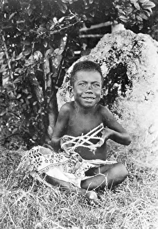 String Prints: Young New Guinea Boy Playing with String