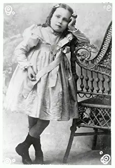 Young Peggy Joyce Leaning on Chair