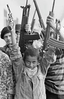 Sandinista Prints: Young Sandinista With Gun And Slingshot