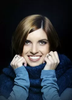 Images Dated 26th November 2011: Young smiling woman wearing a turtleneck sweater, portrait