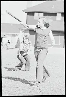 Omaha Prints: Young Softball Player with Artificial Limb in Batting Action