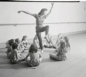 Photographic Study Prints: Young Students Observing Their Teacher Performing Ballet Moves