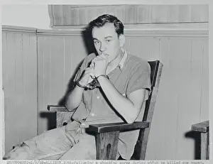 Iowa Prints: Young Suspect Pensively Reclining at Station