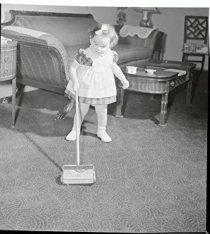 Formula One Prints: Young Toddler Using Her Toy Floor Sweeper