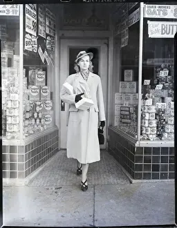 Groceries Prints: Young Woman Coming Out Of Grocery