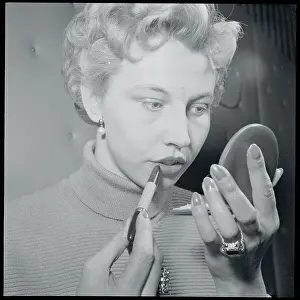 Hannover Prints: Young Woman with Compact Applying Lipstick