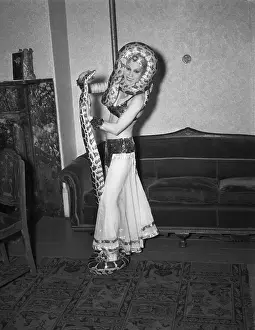 Young woman dancing with snakes