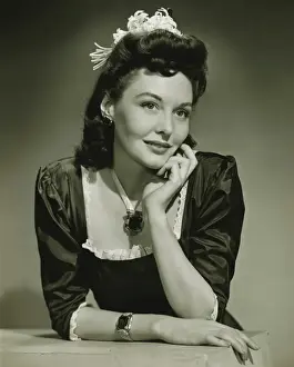 Bracelet Prints: Young woman in evening wear in studio, (B&W), close-up