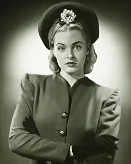 Glove Prints: Young woman in fashionable suit and hat in studio, (B&W), portrait