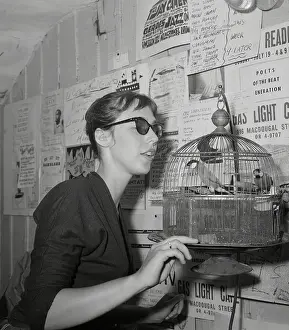 Beatnik Prints: Young Woman at Gaslight Feeding Birds in Hanging Cage