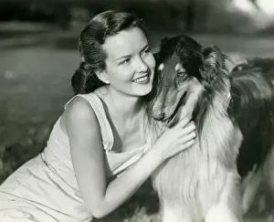 Collie Prints: Young woman hugging Collie in park
