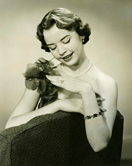 Pearl Collection: Young woman looking at ring, (B&W)