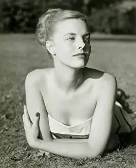 Hair Back Prints: Young woman lying on grass