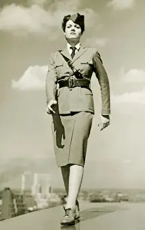 Rooftop Prints: Young woman in military outfit marching on rooftop, portrait