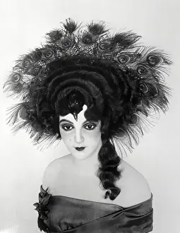 Strapless Prints: Young Woman Modeling Peacockfeather Headdress. March 31, 1922