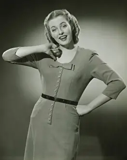 Hand On Hip Prints: Young woman pointing at herself, posing in studio, (B&W), portrait